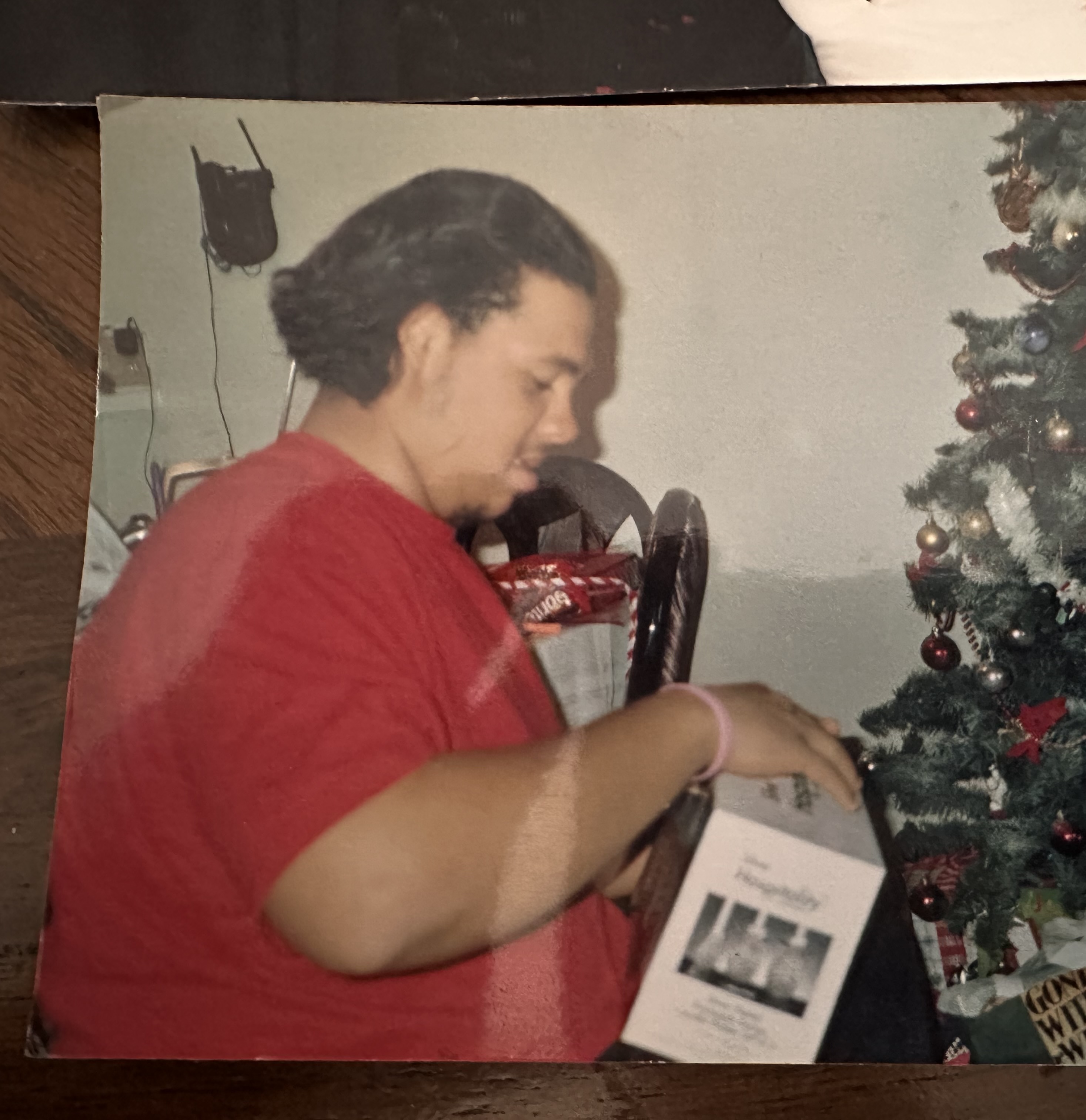 A holiday family snapshot beside a Christmas tree